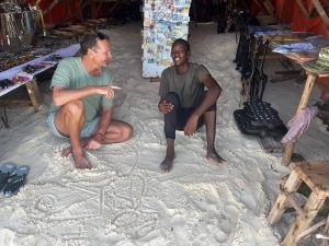 Beratung auf afrikanisch im Sand